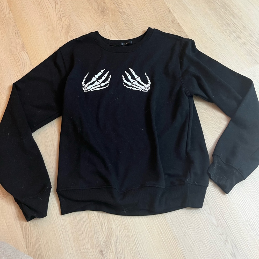 Black skeleton hands sweater